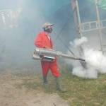 Petugas memfogging tenda tempat pembukaan muktamar. (foto: rony suhartomo/BANGSAONLINE)