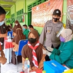 Gerai Vaksin Presisi Door to Door yang digelar Polres Pamekasan di Pesantren Sabilul Ihsan, Desa Teja Timur, Kabupaten Pamekasan. 