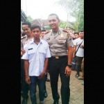 Kapolres Pasuruan AKBP Raydian Kokrosono foto bersama saat mengunjungi  kediaman 