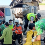 Jenazah korban saat dievakuasi petugas dari dalam kabin truk.