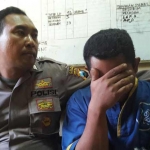 Kadi Winarso saat diamankan  di Mapolres Pasuruan.