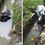 Petugas mengevakuasi mayat yang ditemukan di parit.