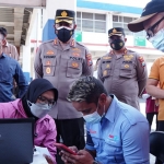 Vaksinasi Mobile Merdeka Semeru Polresta Sidoarjo di Terminal Purabaya. (foto: ist)