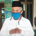 KH. Dr. Marzuki Mustamar.