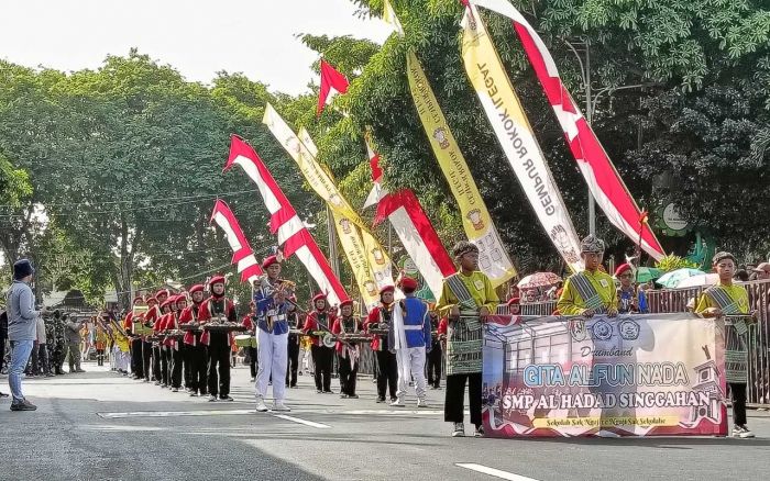 Peringati HJT ke 730, Satpol PP Tuban Sosialisasikan Gerakan Gempur Rokok Ilegal di Acara Drumband