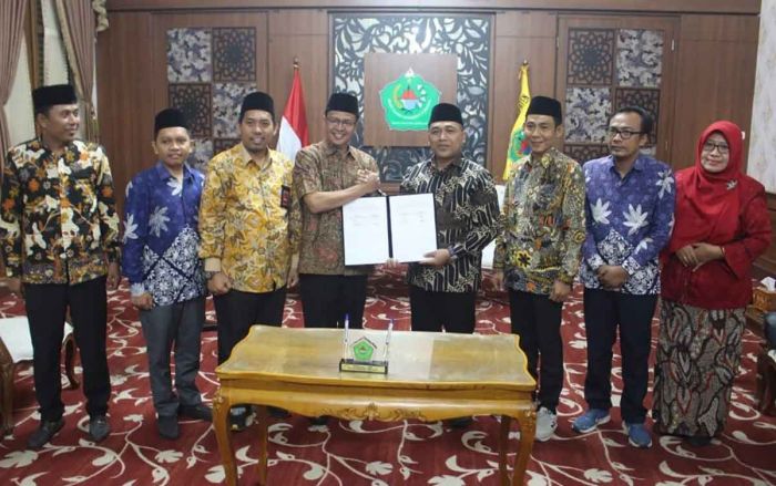 Bersama KPU, Pemkab Pamekasan Teken NPHD Rp50 Miliar